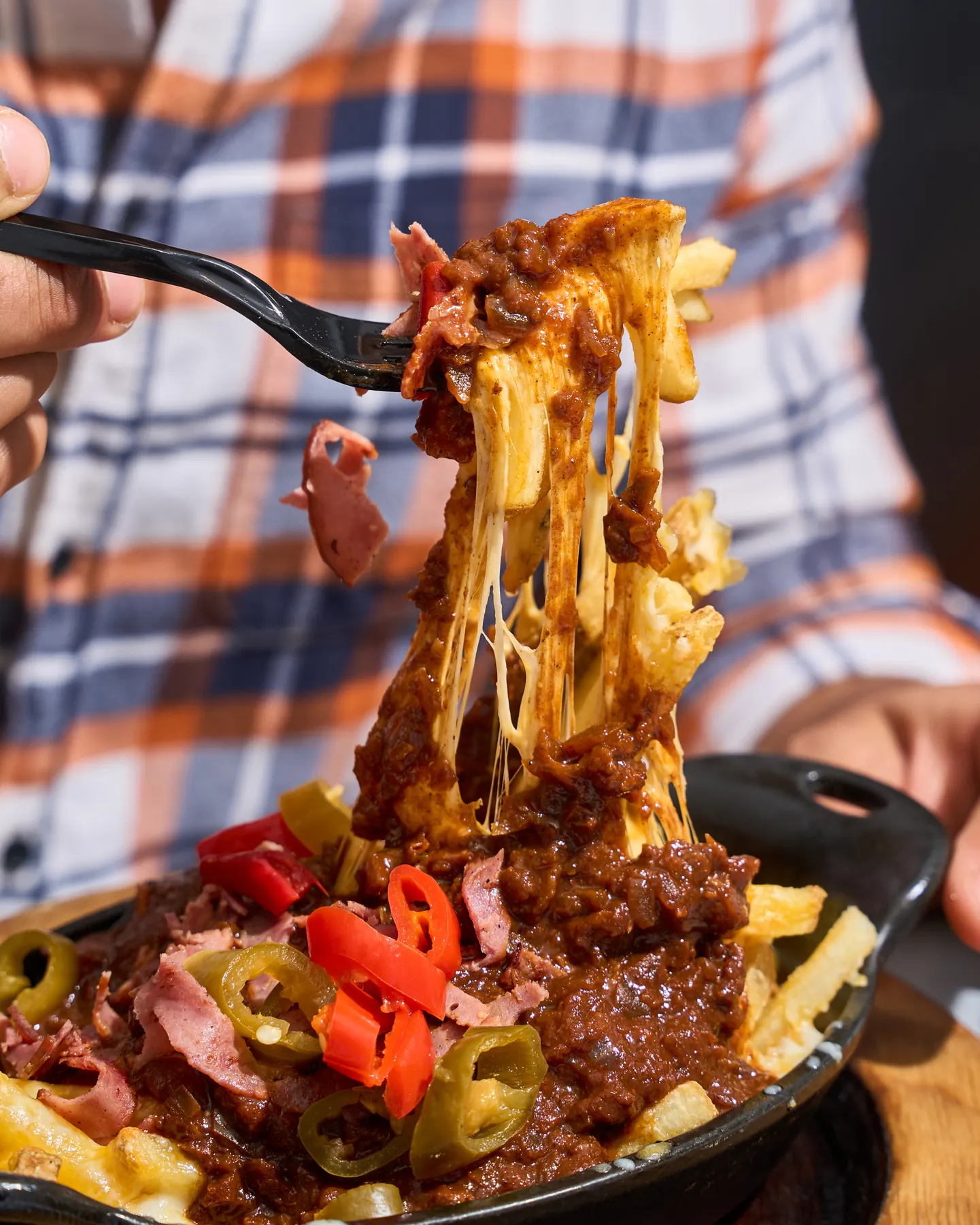 Top Bun cheese fries with house-made chili and pickled peppers